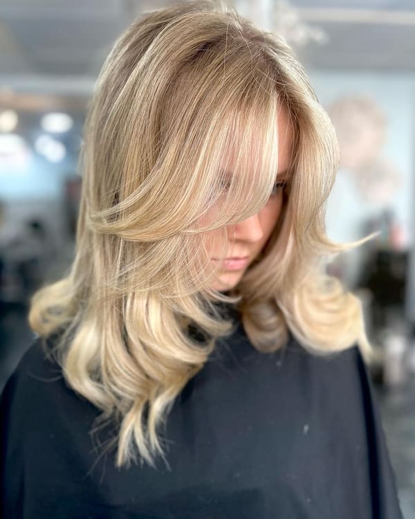 Blonde Bouncy Hair with Curtain Bangs