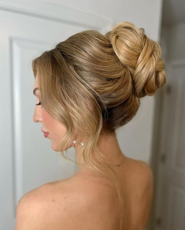 High Bun and Curtain Bangs