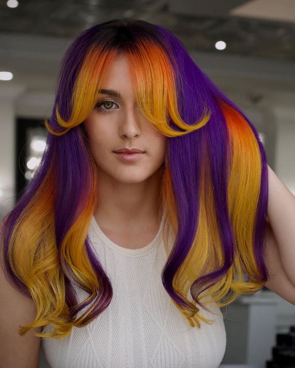 High Contrast Multi Color Hair with Curtain Bangs