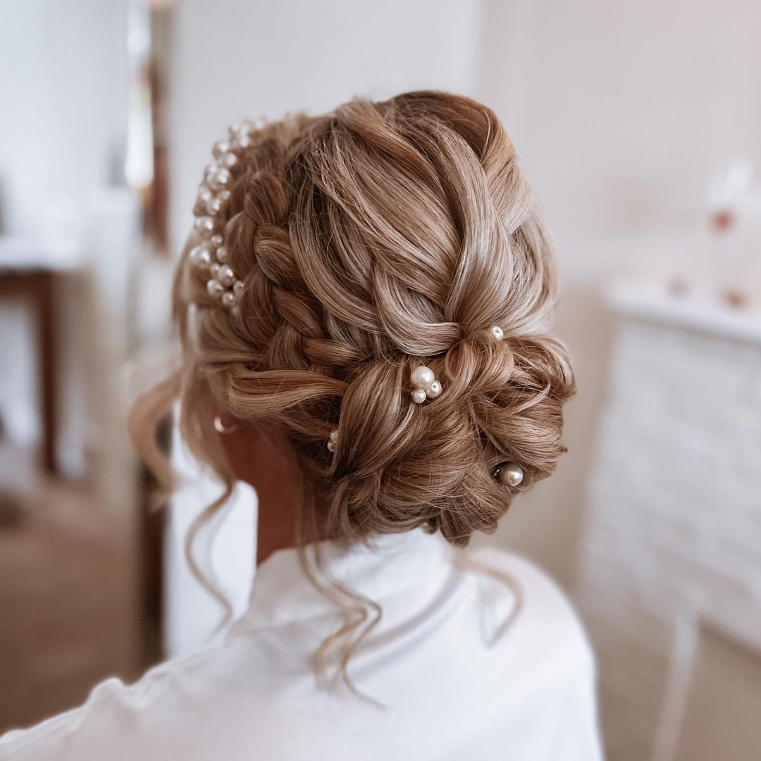 Low Textured Messy Bridal Bun with a Braid