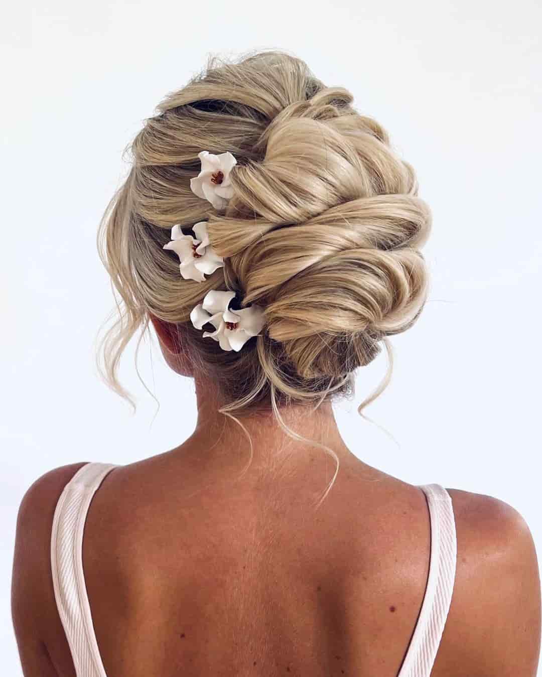 Messy Interwoven Updo with Flower Pins
