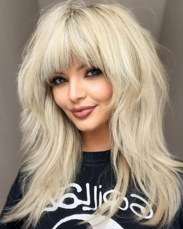 Thick Blonde Shag Haircut with Bangs