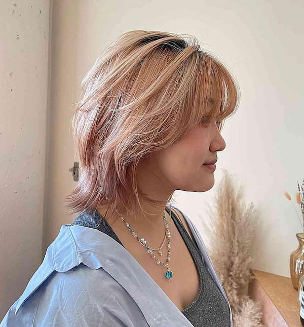 Peach Blonde Hair with Butterfly Layers and Bangs