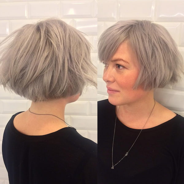 Cropped Gray Haircut with Layers and Bangs