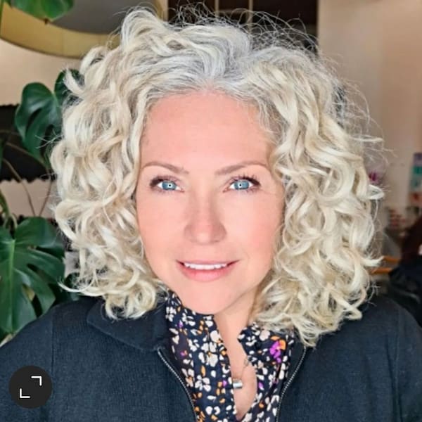 Medium-Length Gray Hairdo with Thick Curls