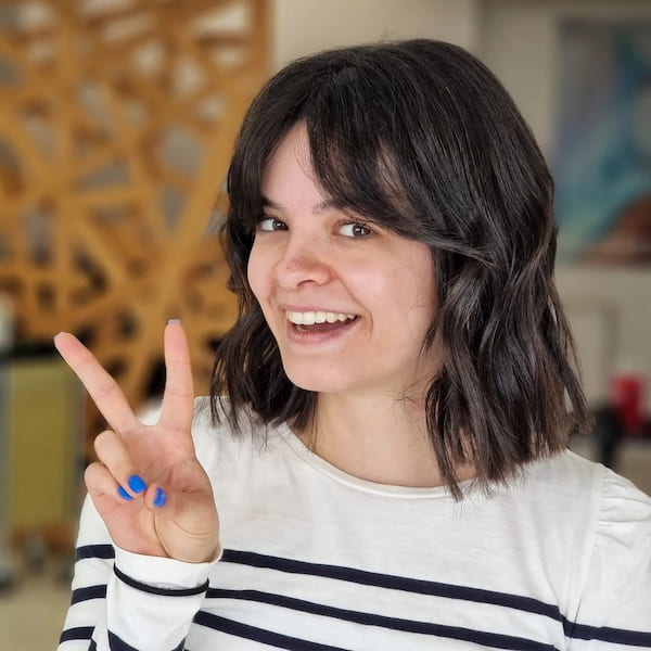 Shoulder-Length Bob Haircut with Curtain Bangs