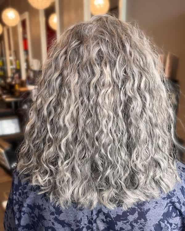 Shoulder-Length Gray Curls with Highlights