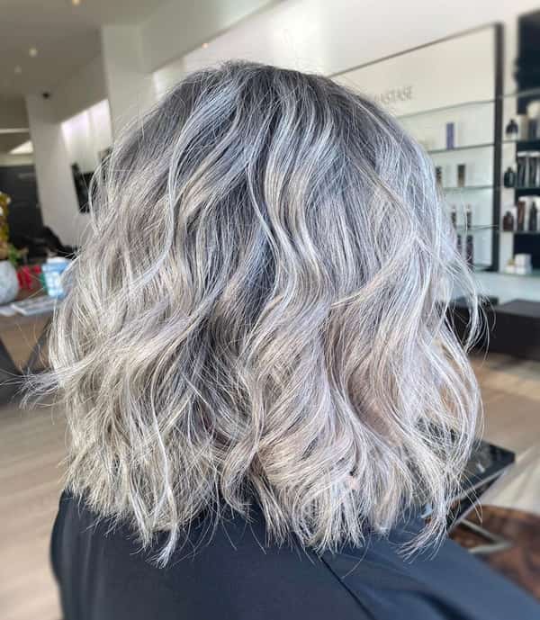 Shoulder-Length Gray Hairdo with Rough Curly Edges
