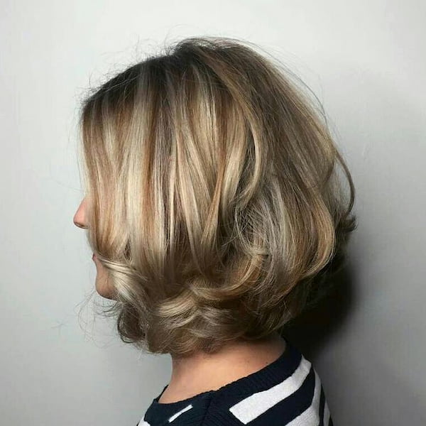 Styled Layered Blonde with Dimensional Highs and Lows