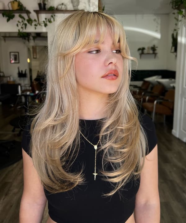 Barbie Blonde Haircut with Bangs and Wispy Layers