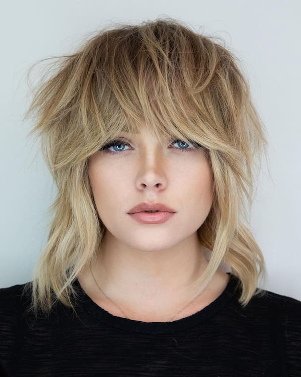 Blonde Shoulder-Length Shag Bob with Overlapping Bangs