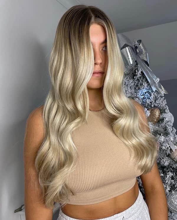 Blonde Wavy Haircut with Face Framing Layers
