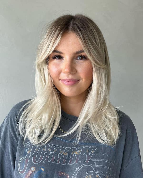 Blunt Layered Blonde with Curtain Bangs