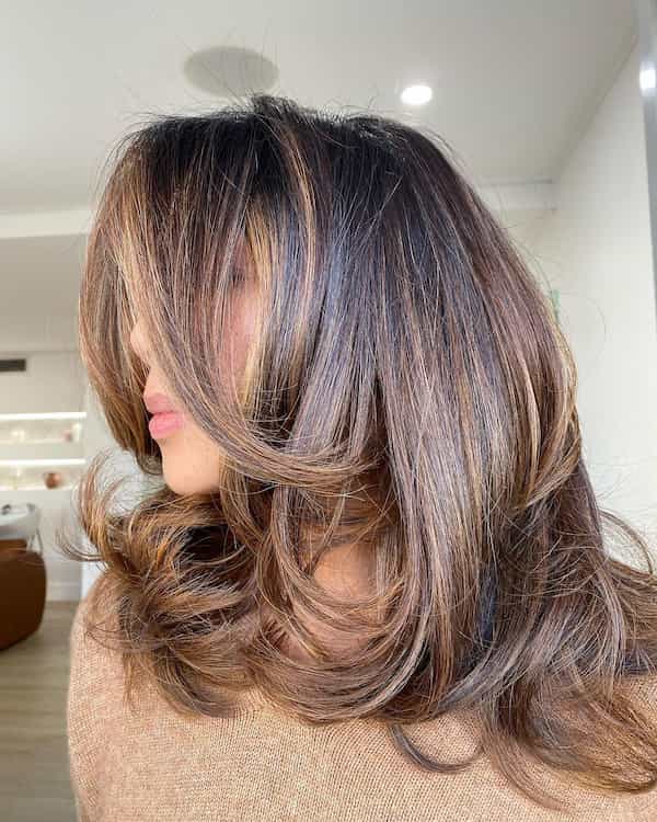 Bouncy Blow Dry Feathered Haircut with Layers and Bangs