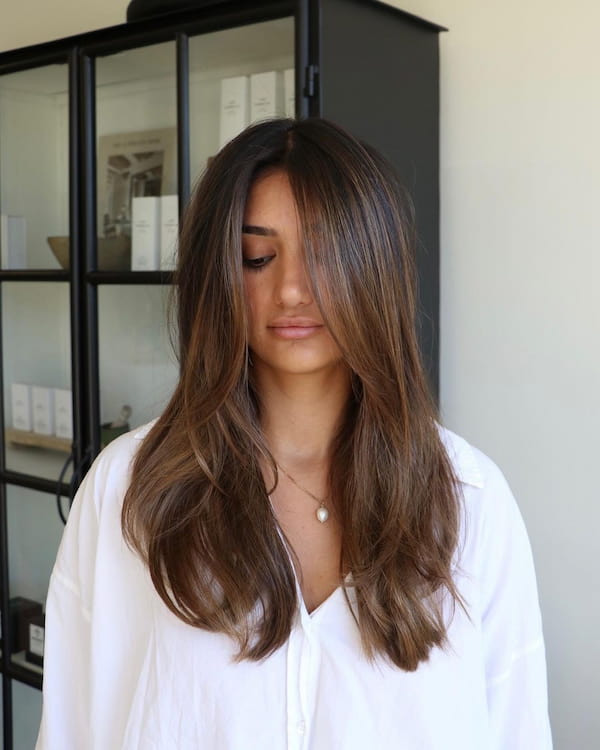 Chic Sleek Layered Haircut with Bangs