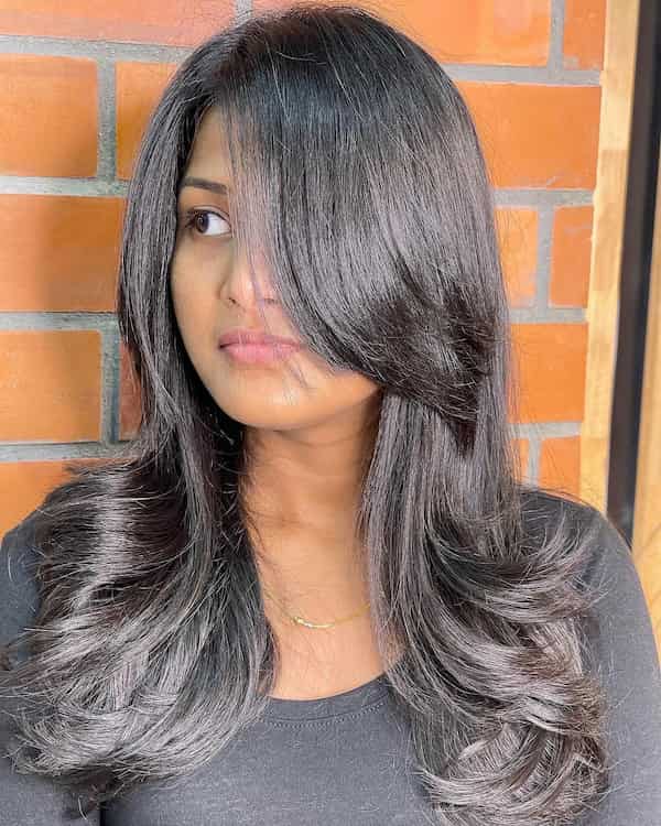 Cute Mid-Length Haircut with Feathered Layers for Thick Hair