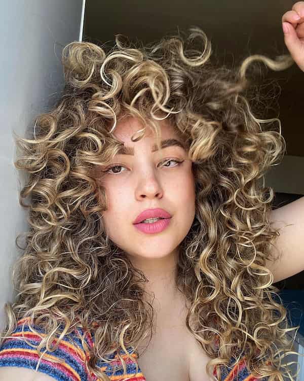 Dimensional Blonde Face Framing Curly Hair