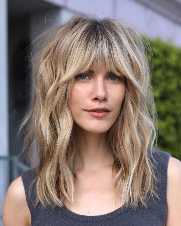 Dimensional Mid-Length Wolf Cut with Fringe