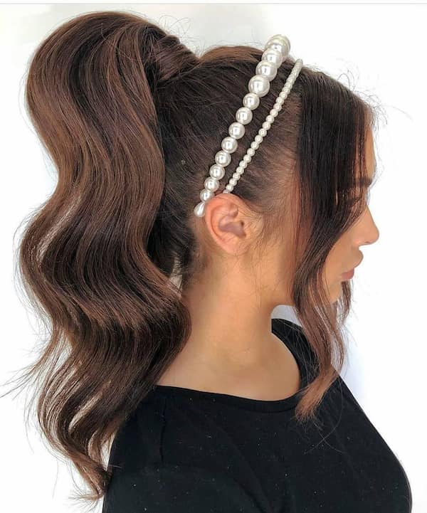 High Ponytail with Pearls and Curtain Bangs