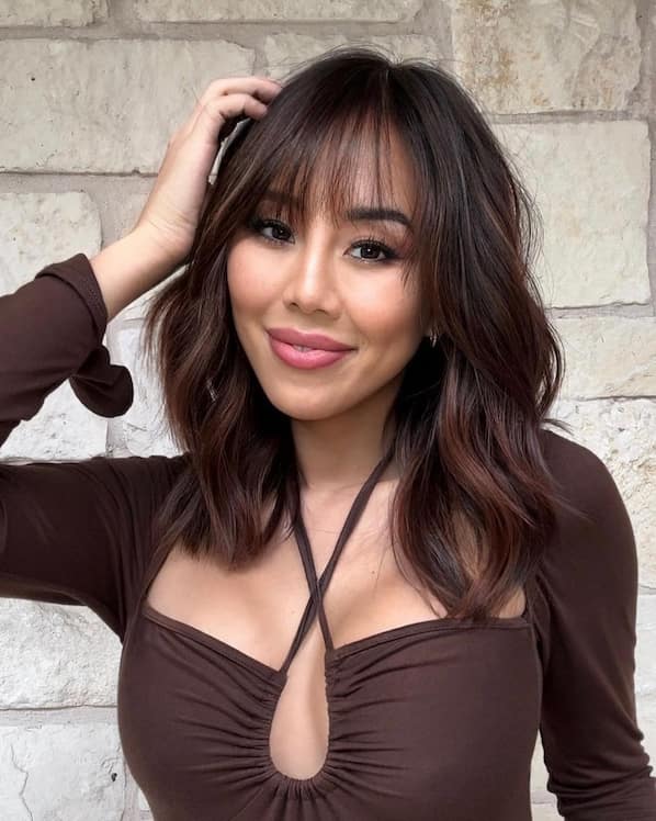 Light Red Wispy Layered Haircut with Bangs