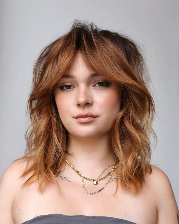 Medium-Length Shag Haircut with Curtain Bangs