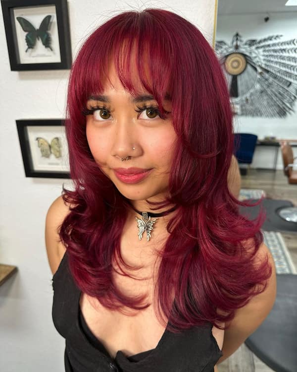 Raspberry Medium Length Haircut with Feathered Layers and Fringe