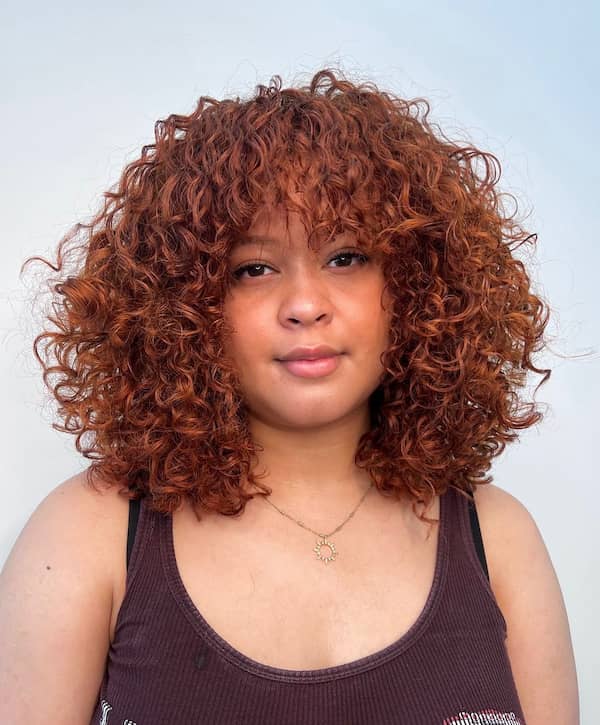 Reddish Messy Curly Hair with Full Fringe
