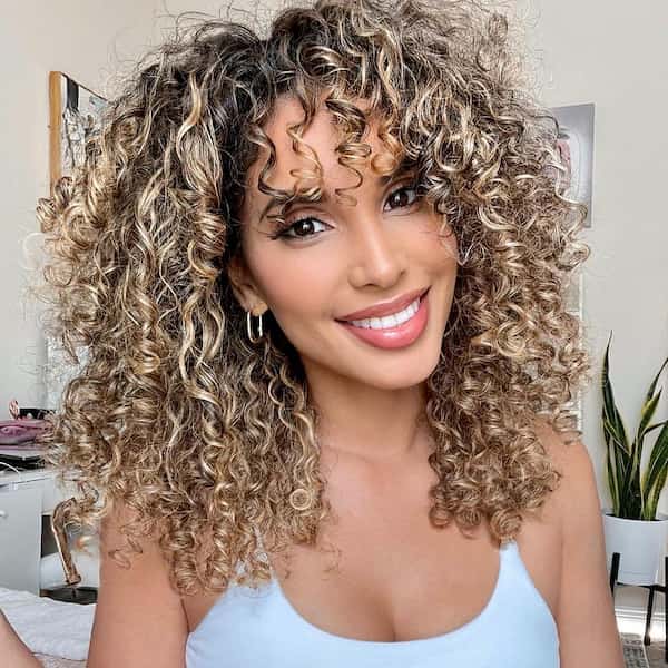 Curly Hair with Curtain Bangs