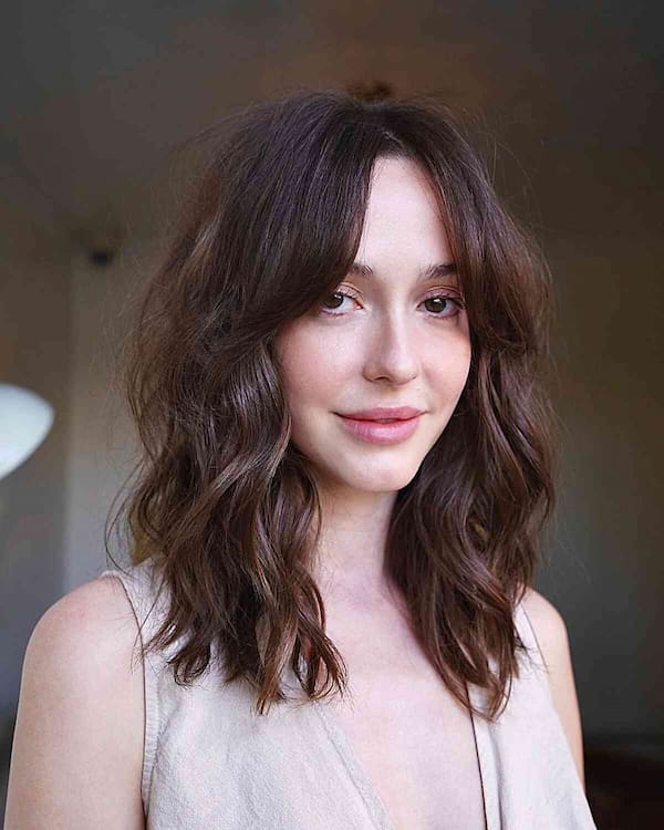 Wavy Haircut with Curtain Bangs