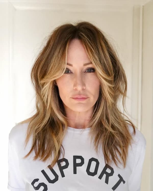 Mid-Length Haircut with Shaggy Layers and Curtain Bangs