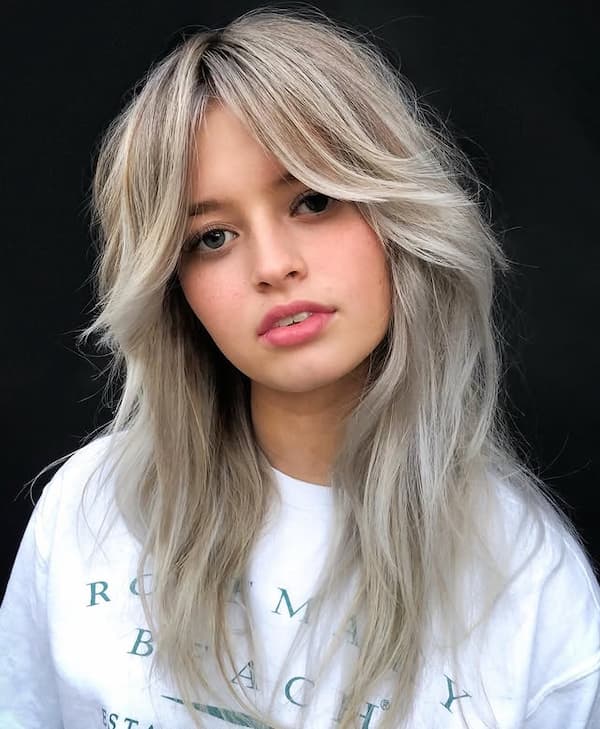 Blonde Shaggy Haircut with Curtain Bangs 