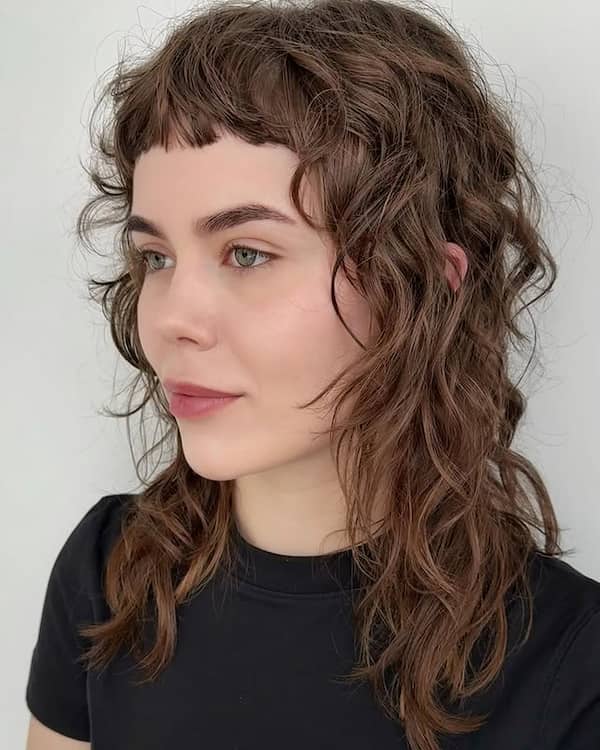 Floaty Layered Wavy Haircut with Chunky Fringe