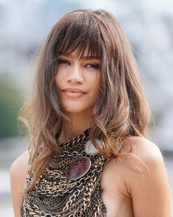 Layered Mid-Length hair with Wispy Bangs