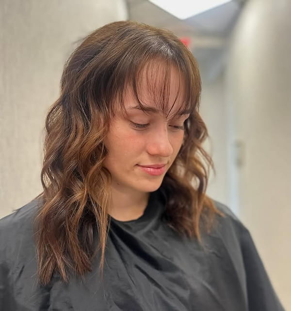 Shoulder-Length Wavy Hair with Wispy Bangs 