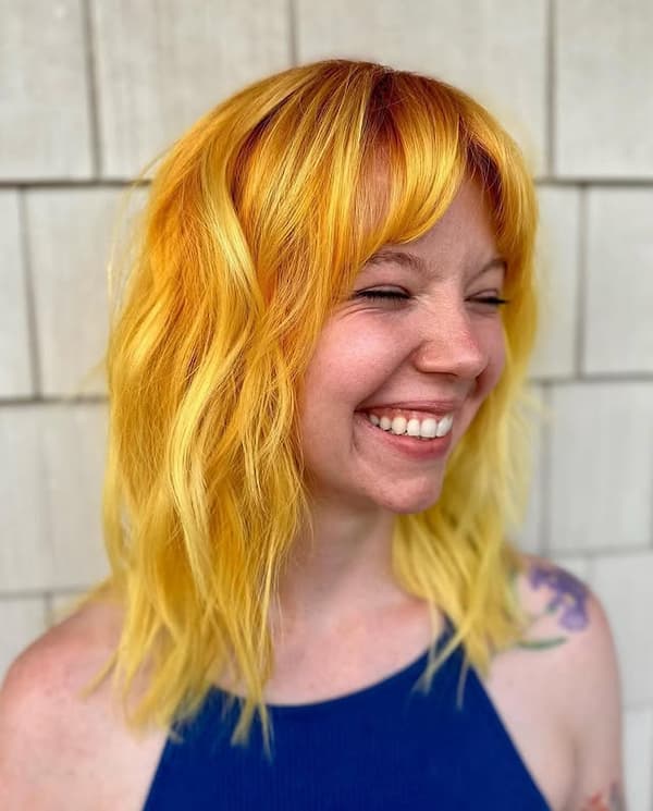 Yellow Shoulder-Length Haircut with Choppy Bangs 