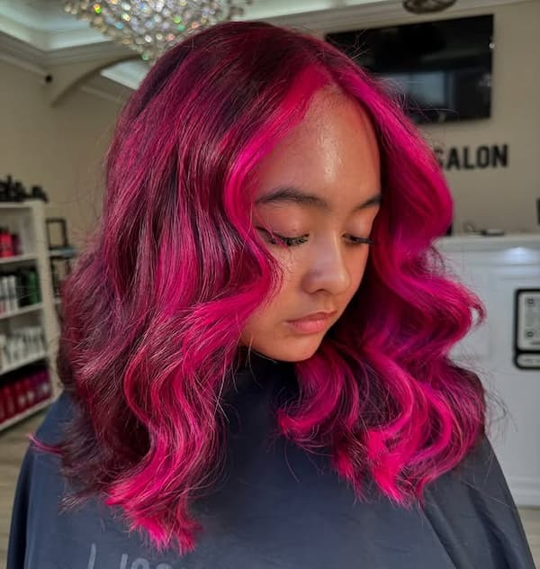 Pink Center-Parted Wavy Haircut