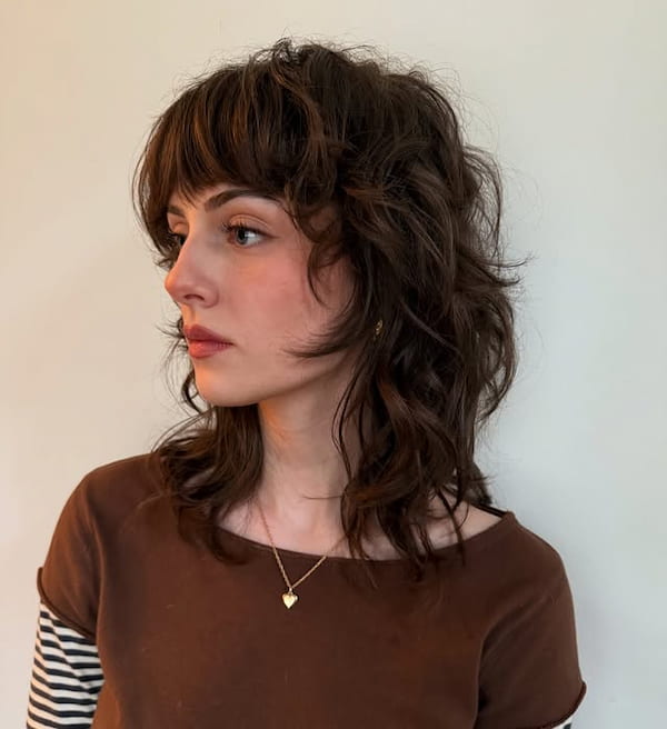 Shoulder-Length Shaggy Mullet with Blunt Bangs