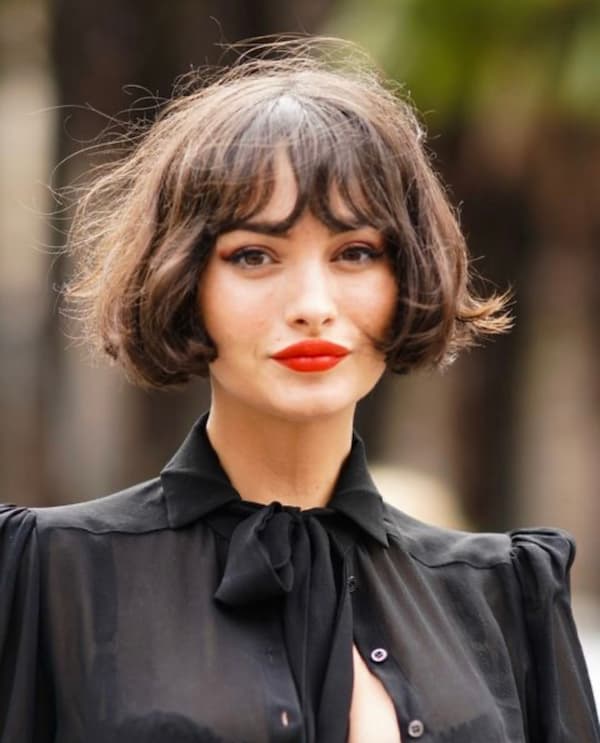 Chin-Length Layered Bob with Wispy Bangs