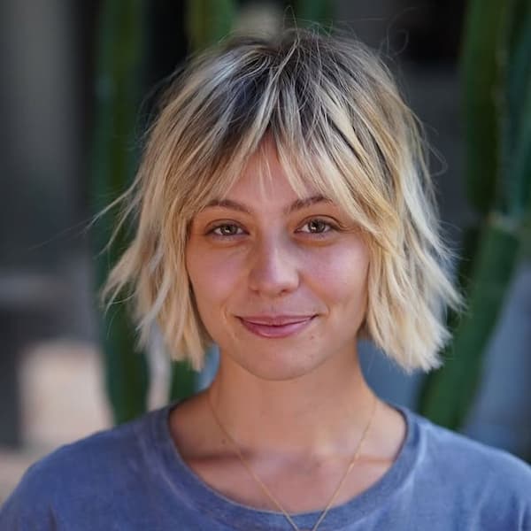 Blonde Shaggy Bob with Wispy Bangs and Darker Roots&nbsp;
