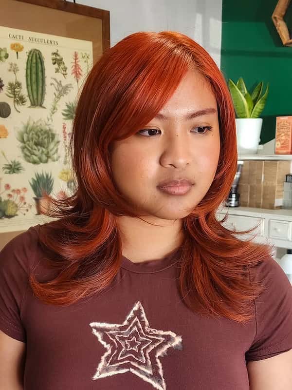 Reddish Feathered Haircut with Side Bangs&nbsp;