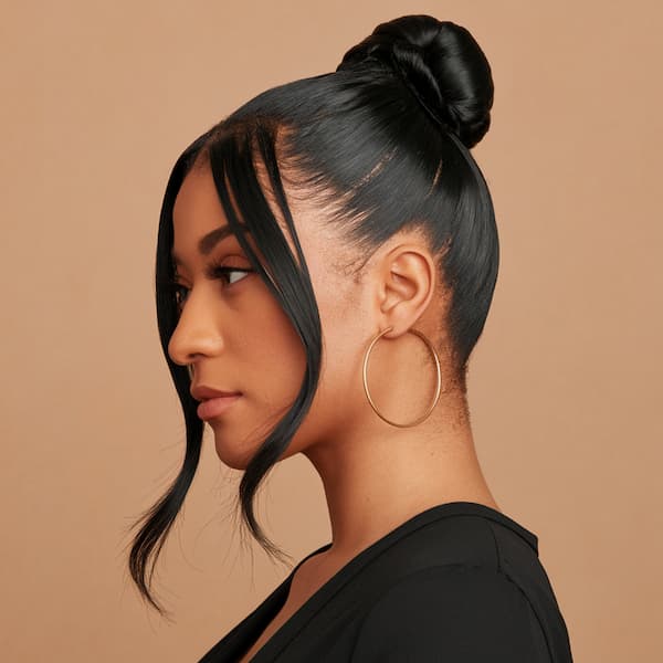 Sleek Center Bun with Tendrils