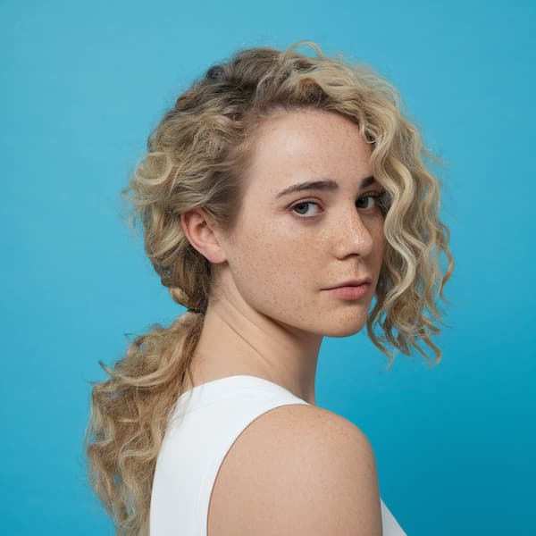 Curly Side Ponytail with Side Bangs